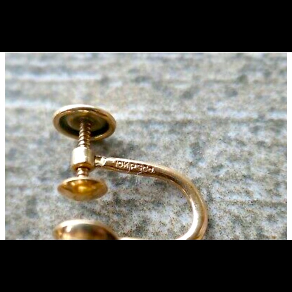 10k gold and ruby screw back earrings.